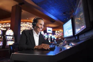 A cheerful woman in traditional clothing using her smartphone during a festive moment, showing how easily the SAGISAGPH app fits into everyday life.