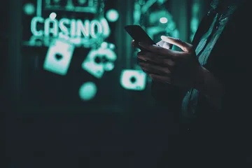 A close-up shot of golden coins falling around a spinning roulette wheel, representing immersive casino action at SAGISAGPH.