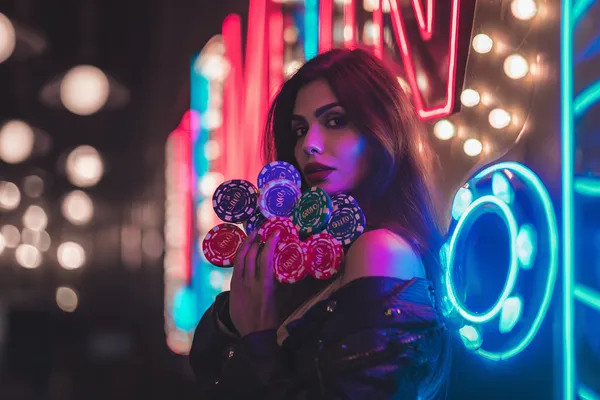 A woman in a luxurious green gown next to an ornate roulette wheel, capturing the upscale casino mood of SAGISAGPH.